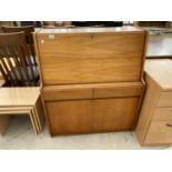 A RETRO TEAK BUREAU WITH FALL FRONT, TWO DOORS AND TWO DRAWERS