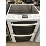 A ZANUSSI COOKER WITH CERAMIC HOB AND DOUBLE OVEN AND GRILL IN NEED OF MINOR CLEAN AND WORKING ORDER
