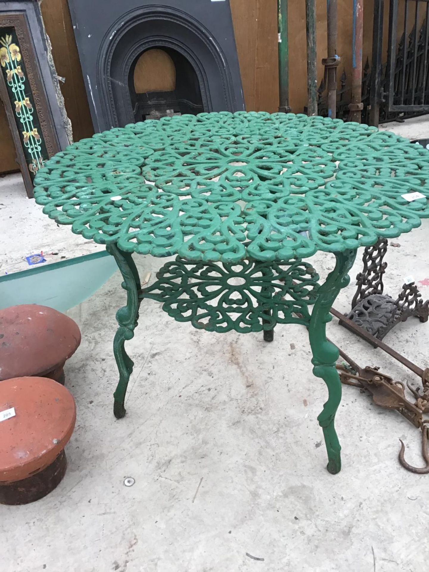 A GREEN PAINTED ORNATE CAST IRON GARDEN TABLE WITH LOWER SHELF - Image 2 of 2