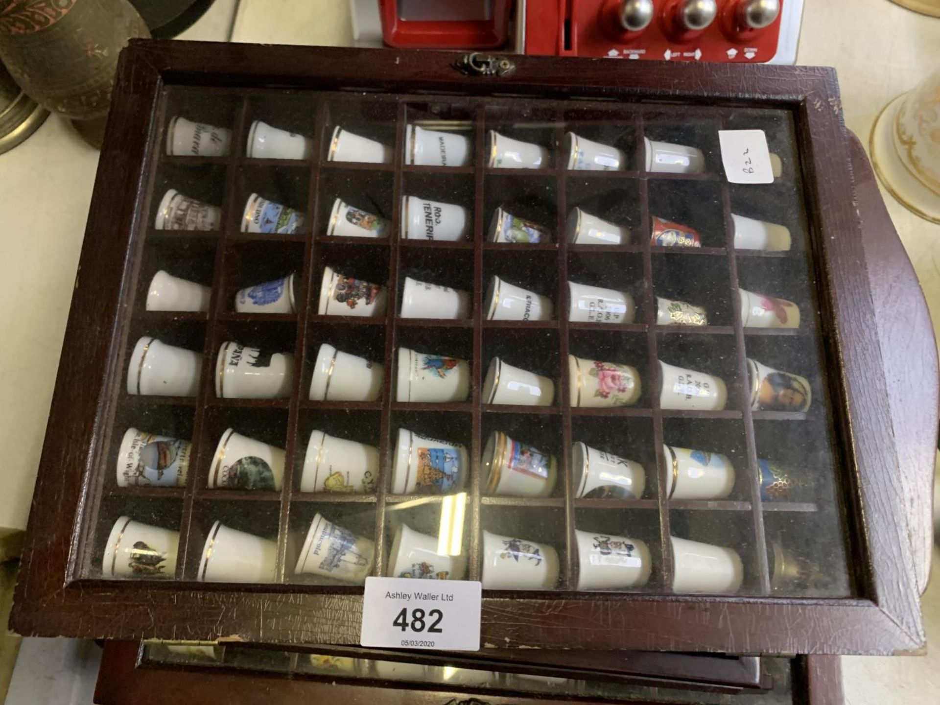 A LARGE COLLECTION OF CERAMIC THIMBLES IN DISPLAY CASES - Image 2 of 4