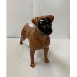 A BESWICK CERAMIC DOG FIGURE