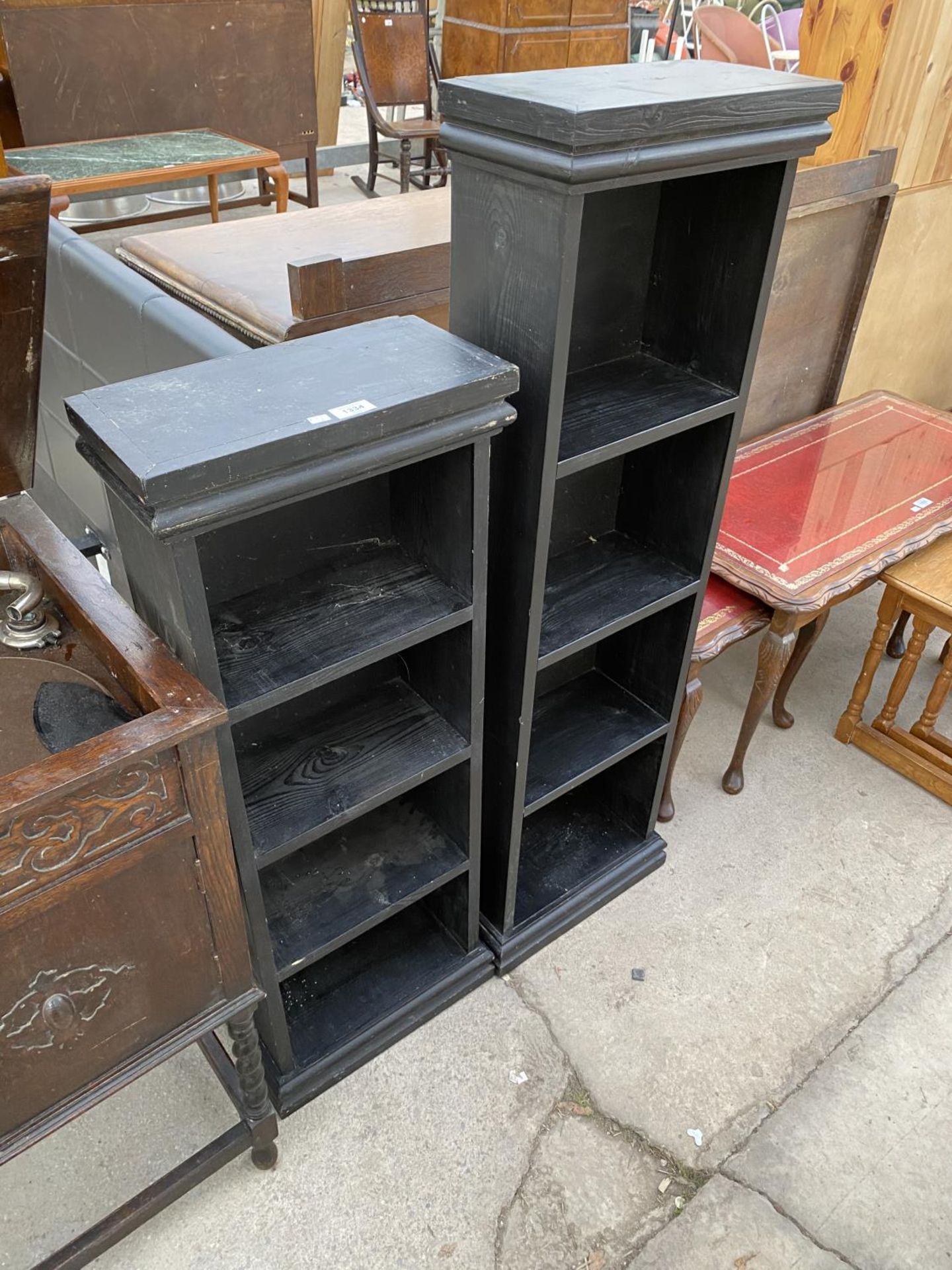 TWO BLACK ASH BOOKSHELVES