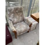 A RECLINING ARMCHAIR AND FOOTSTOOL