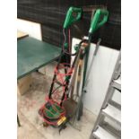AN ELECTRIC ROTOVATOR IN WORKING ORDER AND VARIOUS GARDEN TOOLS TO INCLUDE A SPADE, FORK, RAKE ETC