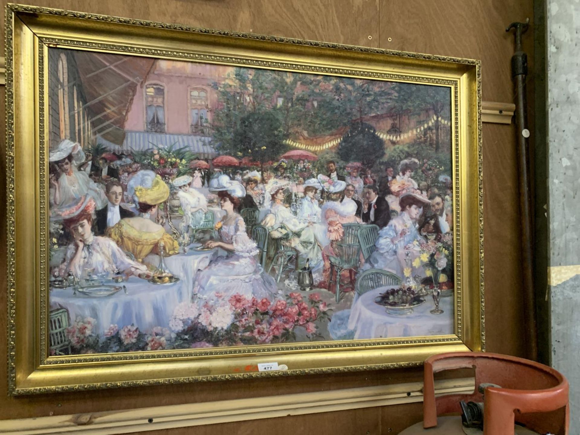 A LARGE DECORATIVE GILT FRAMED PRINT OF A DINING SCENE