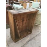 A VINTAGE PINE BOOKCASE IN NEED OF RESTORATION