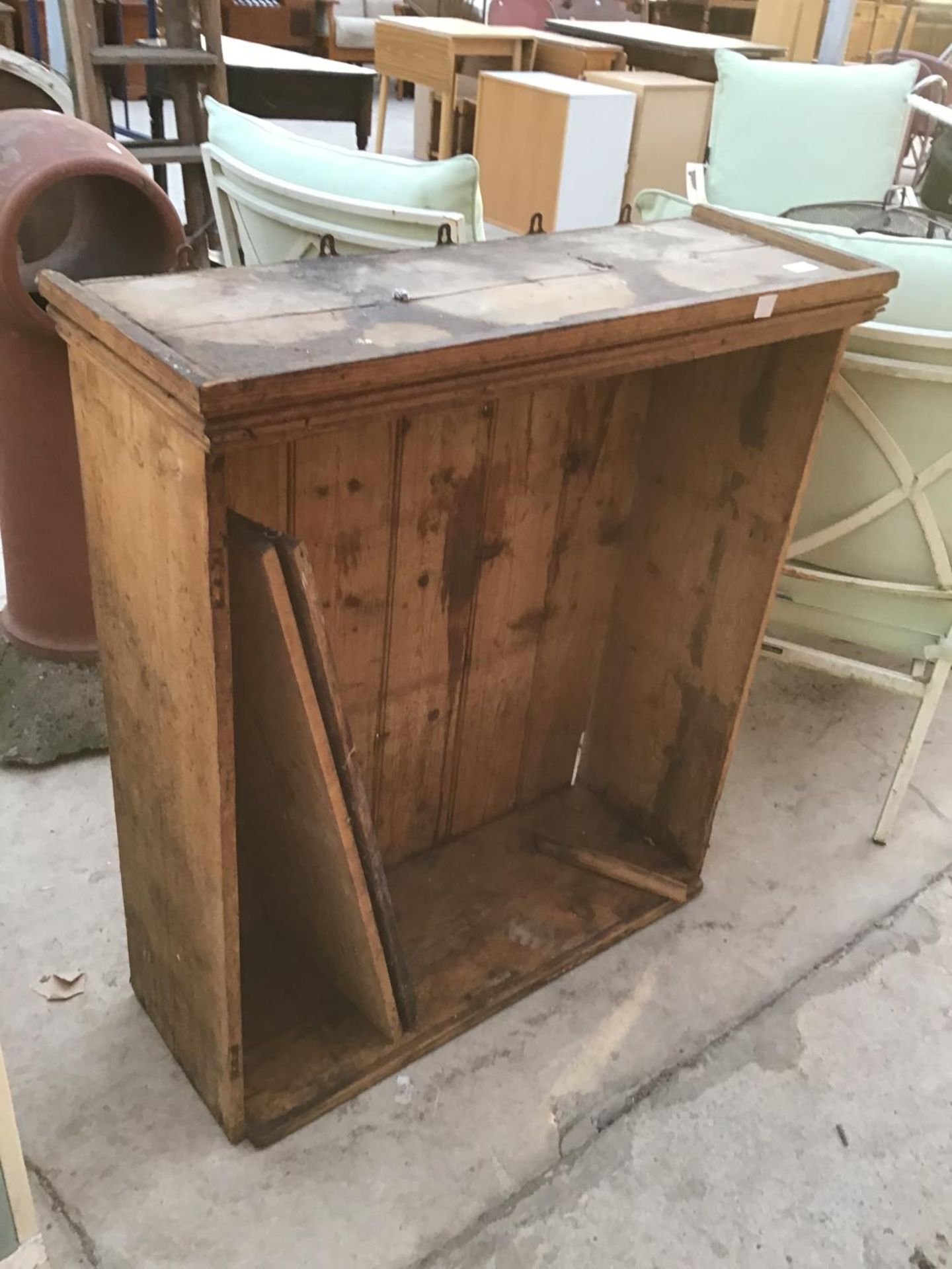 A VINTAGE PINE BOOKCASE IN NEED OF RESTORATION