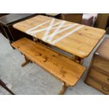 A PINE DINING TABLE WITH TWO BENCH SEATS