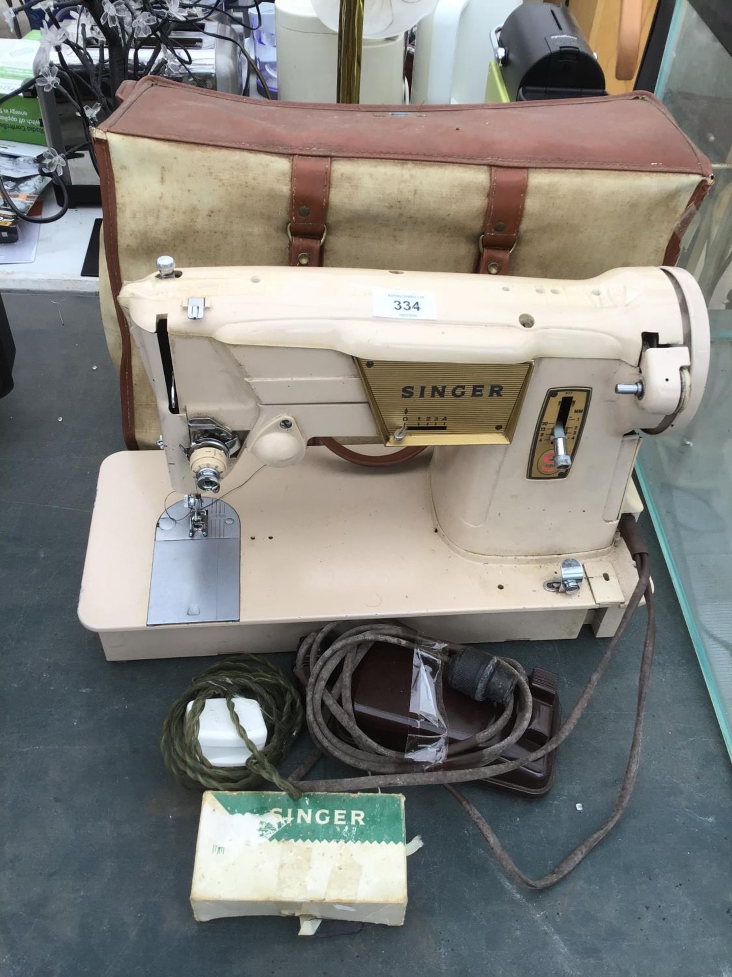 A VINTAGE SINGER SEWING MACHINE WITH CASE, PEDAL AND ATTACHMENTS