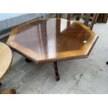 AN OCTAGONAL MAHOGANY COFFEE TABLE