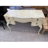 A FRENCH STYLE CREAM DRESSING TABLE WITH FIVE DRAWERS AND THREE SECTION BEVEL EDGE MIRROR (NEEDS