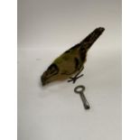 A TIN PLATE KEY WOUND BIRD MODEL