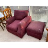 A RED ARMCHAIR AND FOOTSTOOL