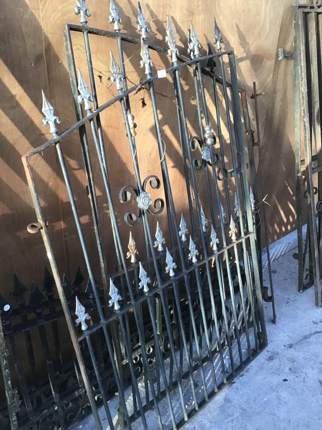 A PAIR OF VERY ORNATE WROUGHT IRON GATES 95CM X 149CM HIGH