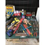 A LARGE COLLECTION OF TOOLS TO INCLUDE SAWS, DRILL BITS, PLIERS, BATTERY CHARGER ETC