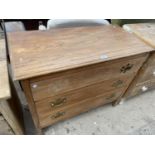 AN OAK CHEST OF THREE DRAWERS