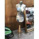 A DECORATIVE TAILORS DUMMY DEPICTING NAMES AND PICTURES OF FASHION TO INCLUDE DIOR, CHLOE, MULBERRY,