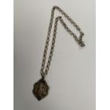 A SILVER CHAIN WITH SILVER PENDANT