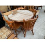 A CIRCULAR PINE DINING TABLE AND FOUR CHAIRS