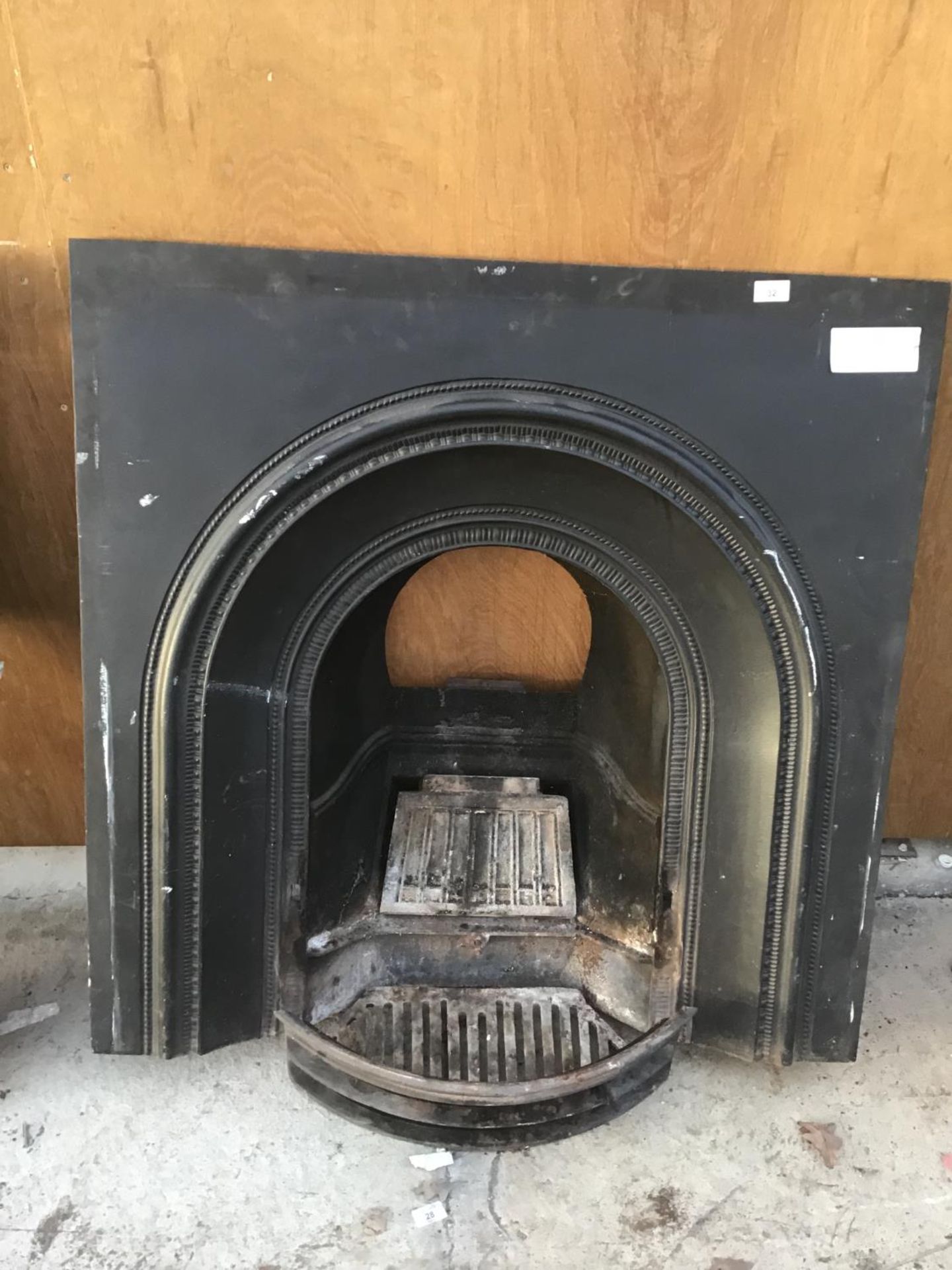 A CAST IRON FIREPLACE WITH GRATE 97CM X 97CM