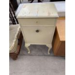 A PAINTED BEDSIDE CABINET WITH ONE DOOR AND ONE DRAWER