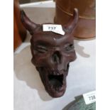 A CAST SKULL WITH HORNS MODEL