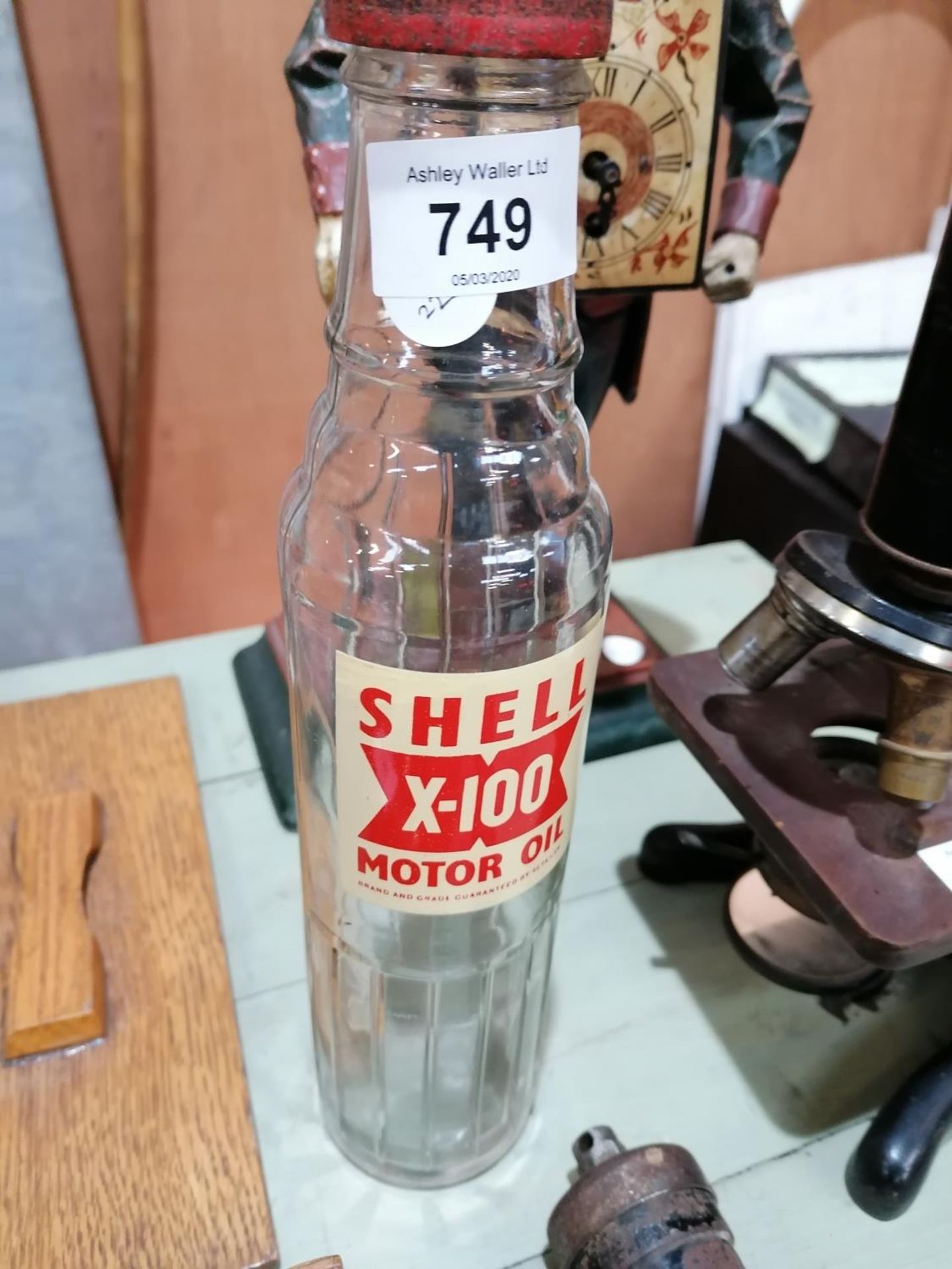 A VINTAGE 'SHELL' X-100 MOTOR OIL BOTTLE