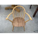 AN ERCOL BEECH ARMCHAIR WITH ELM SEAT