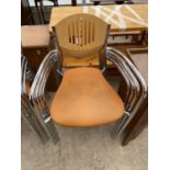 FOUR RETRO STYLE CHROME BASED ARMCHAIRS