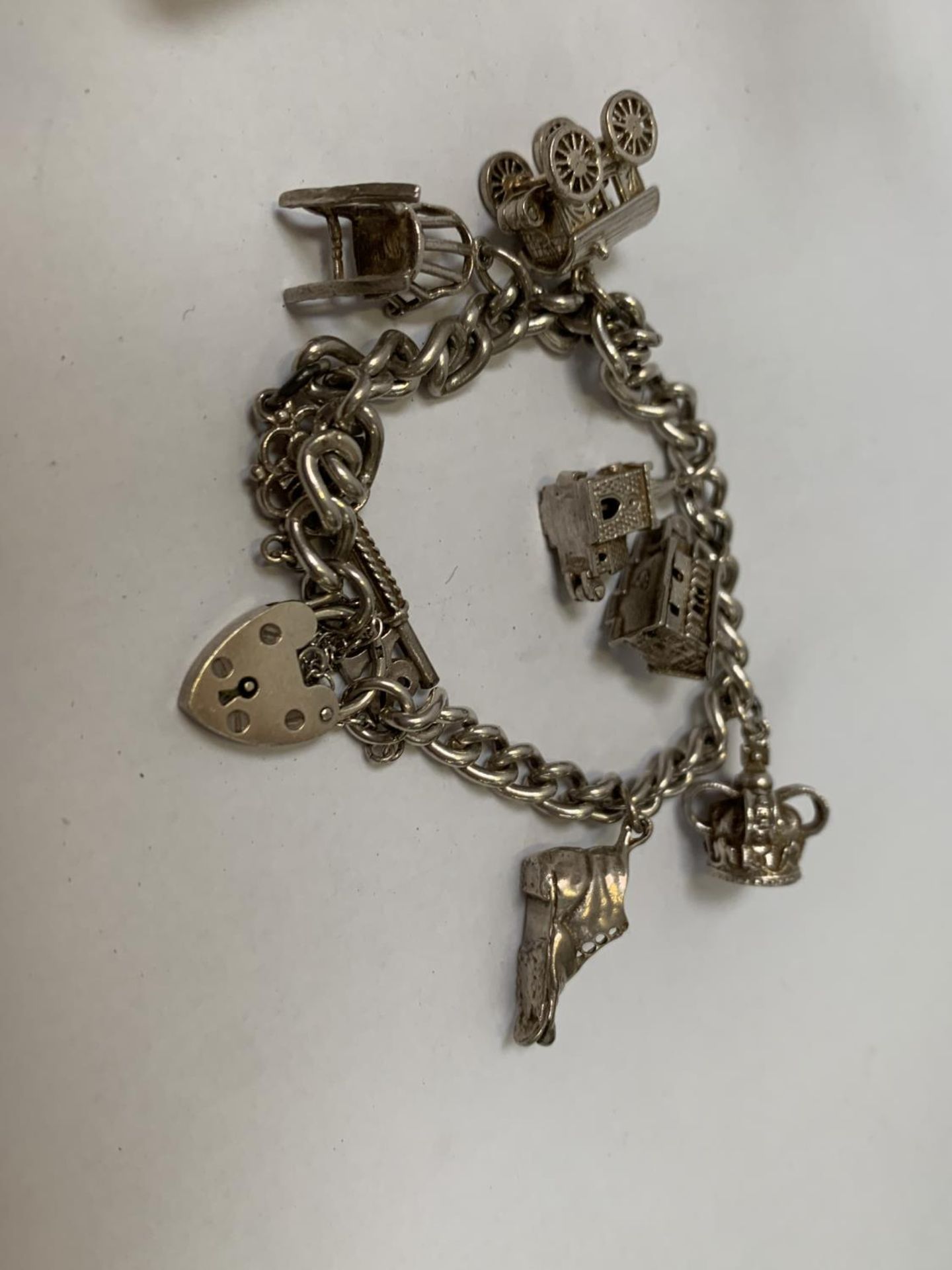 A BOXED SILVER BRACELET WITH SEVEN CHARMS - Image 2 of 2