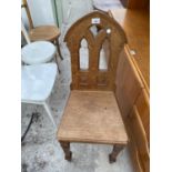 AN OAK CHAPEL CHAIR WITH SOLID SEAT