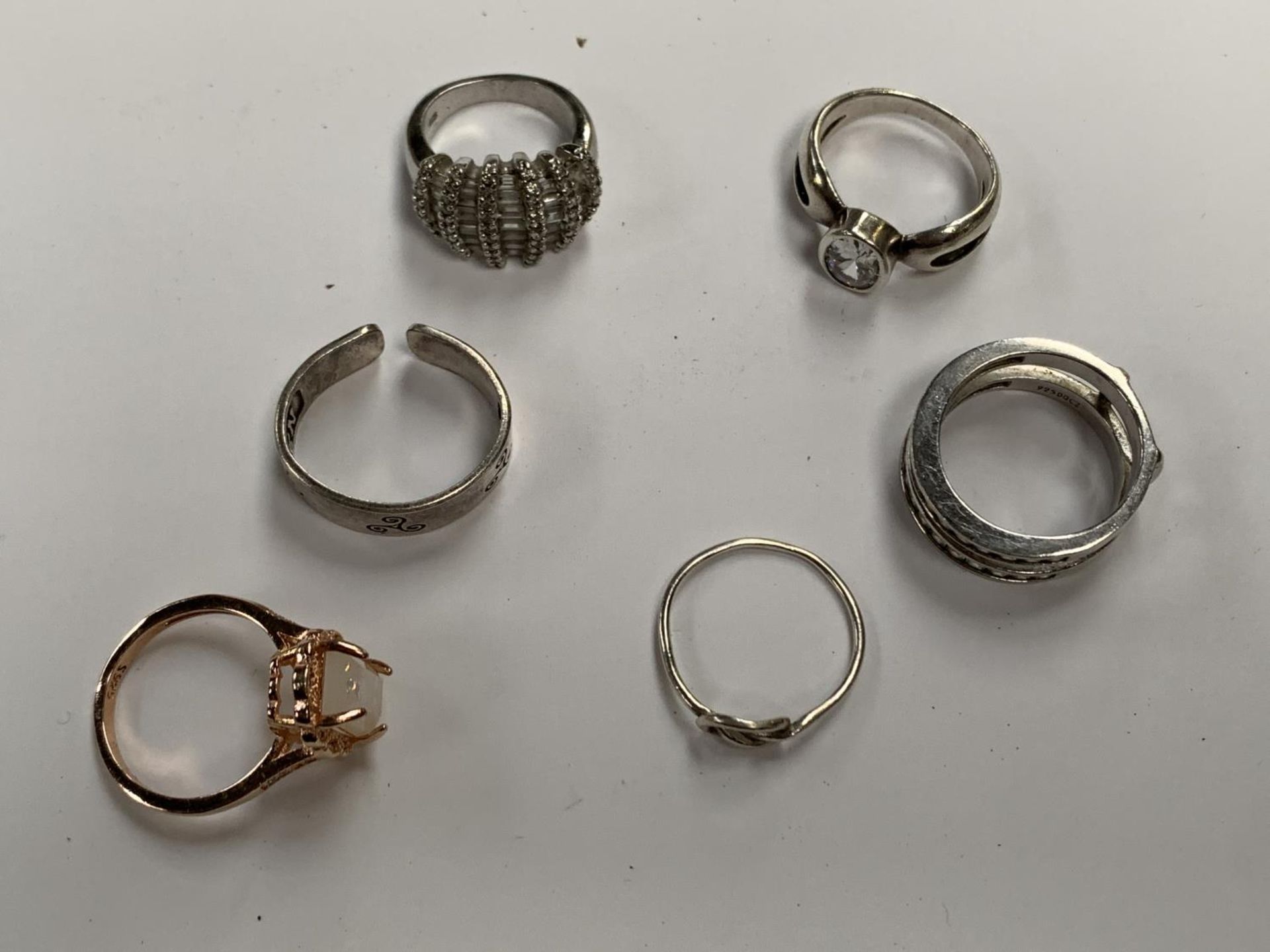 A COLLECTION OF SIX SILVER RINGS