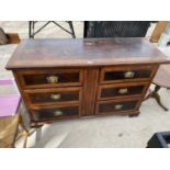 A GEORGIAN OAK SIDEBOARD ON BRACKET FEET WITH SIX DRAWERS HAVING ELABORATE BRASS HANDLES (TOP