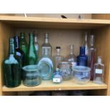 A COLLECTION OF VARIOUS GLASS BOTTLES AND JARS