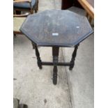 A SMALL OCTAGONAL OAK OCCASIONAL TABLE WITH CARVED TOP