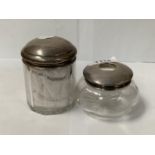TWO GLASS JARS WITH HALLMARKED SILVER LIDS