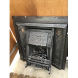AN ORNATE CAST IRON FIRE PLACE WITH GAS FIRE 97CM X 97CM