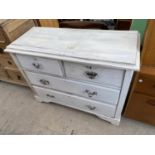 A PAINTED CHEST OF TWO SHORT AND TWO LONG DRAWERS