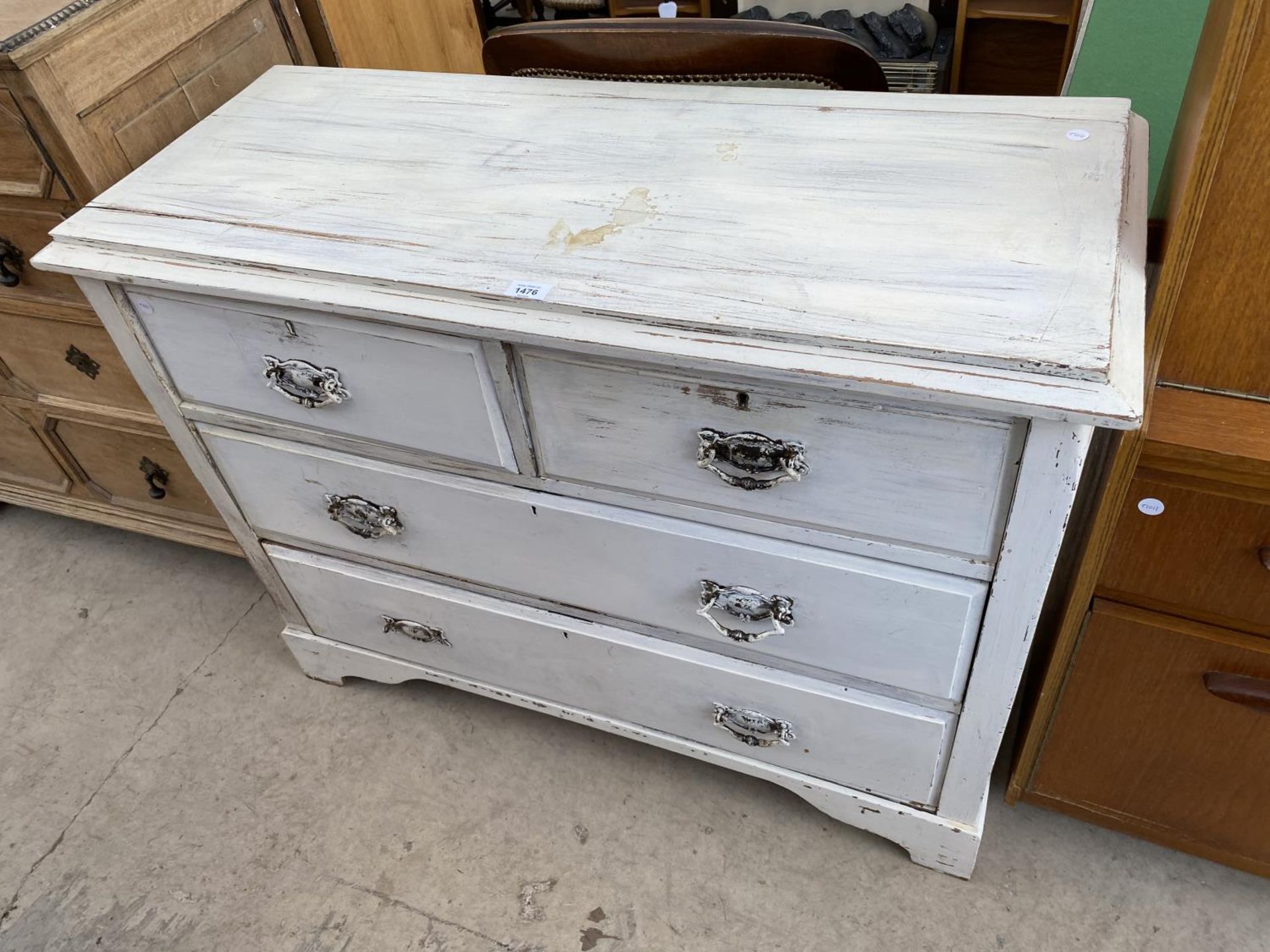 A PAINTED CHEST OF TWO SHORT AND TWO LONG DRAWERS