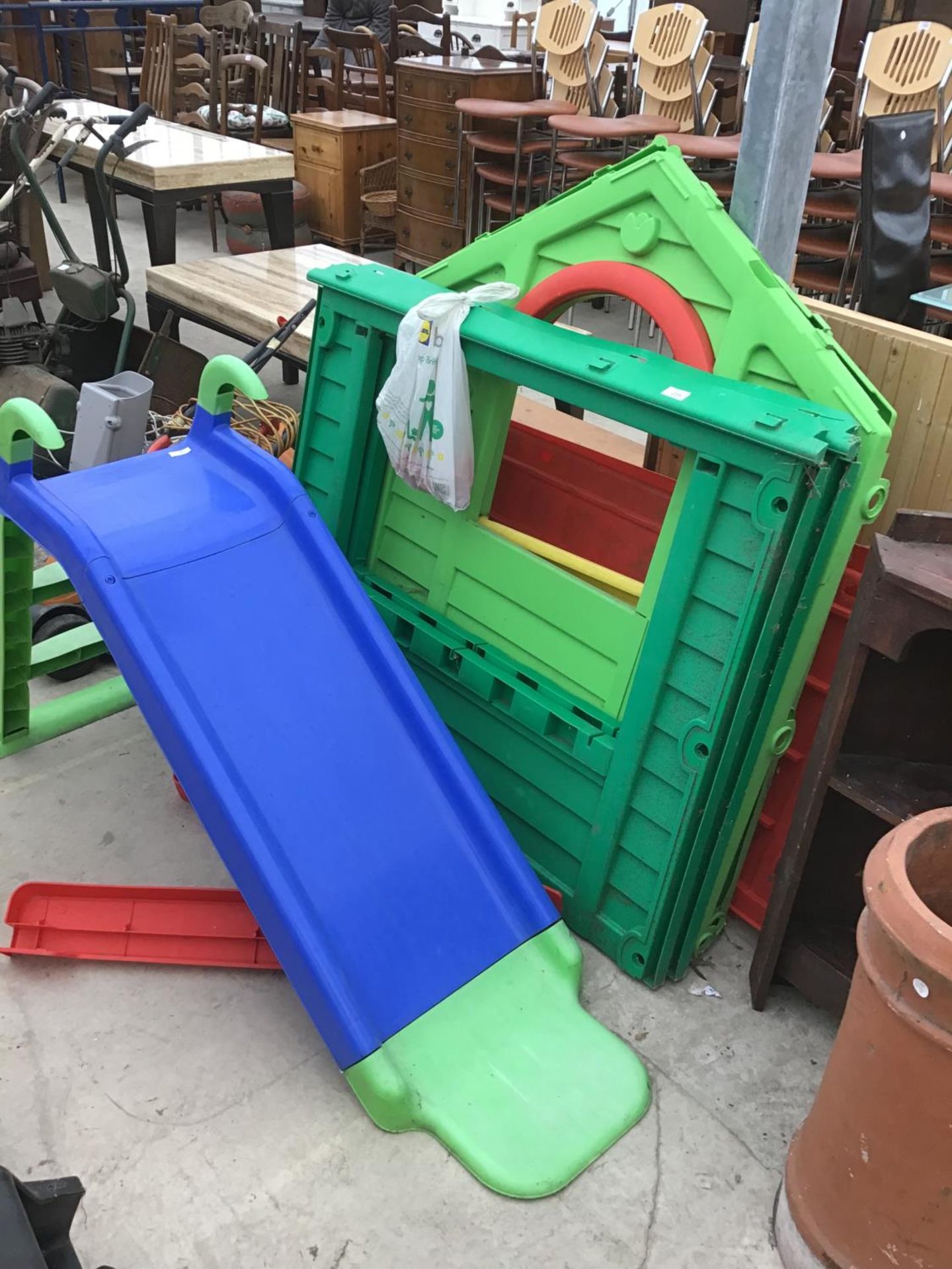 A LITTLE TIKES WENDY HOUSE (COMPLETE WITH ATTACHMENT PIECES) AND A CHILDS SLIDE