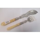 A PAIR OF VICTORIAN ORNATE SILVER FISH KNIFE AND FORK SET WITH BONE HANDLES