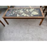 A RETRO TEAK COFFEE TABLE WITH SINGULAR TILE TOP HAVING FLORAL DESIGN