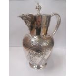 AN EARLY 20TH CENTURY SILVER PLATED MASK JUG WITH FLORAL CHASED AND ENGRAVED DECORATION