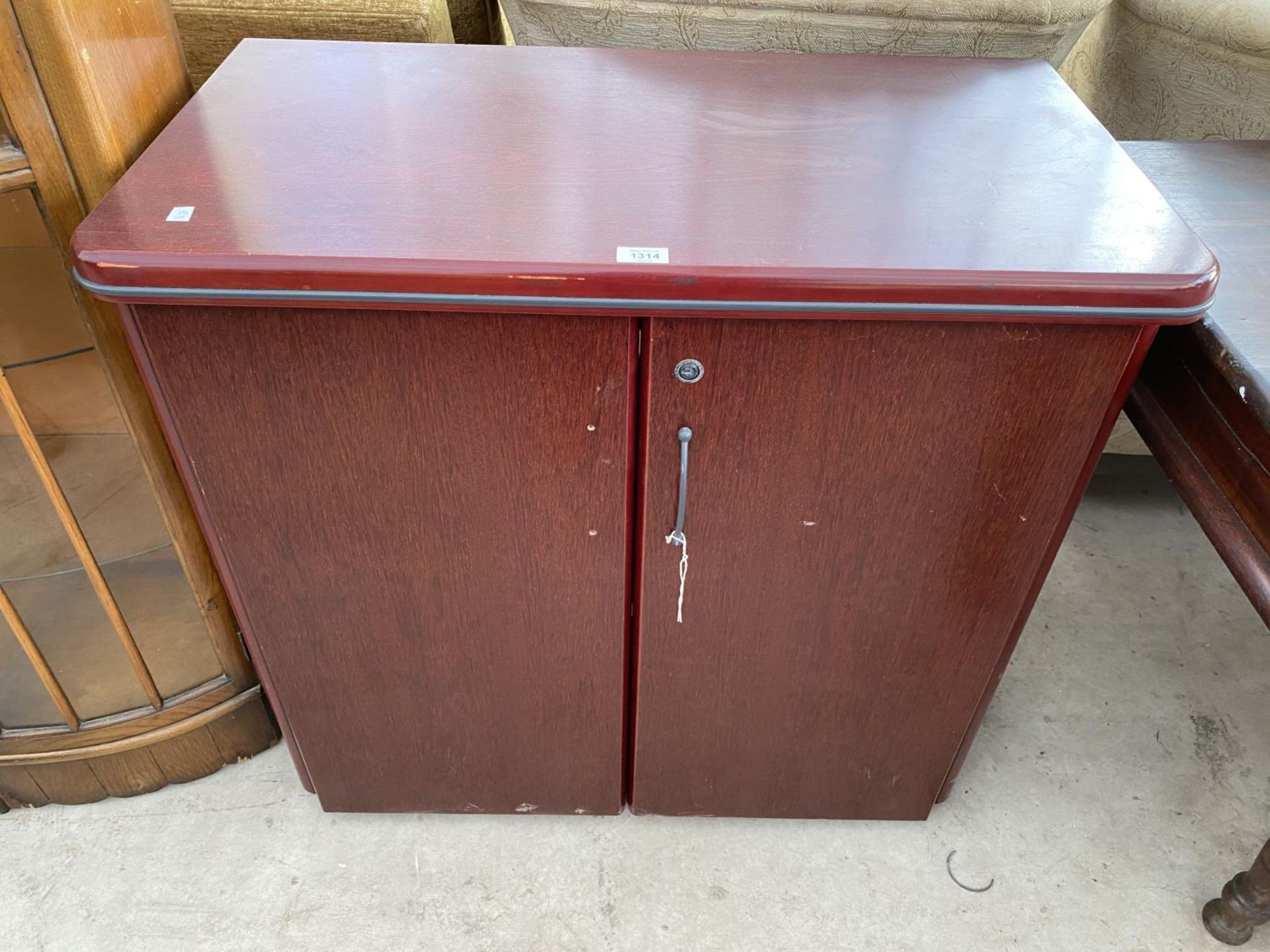 A MAHOGANY CABINET WITH TWO DOORS