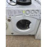 A HOTPOINT INTEGRATED WASHING MACHINE IN WORKING ORDER