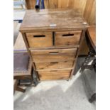 A SMALL PINE CHEST OF TWO SHORT AND THREE LONG DRAWERS WITH FRONT AND REAR ACCESS