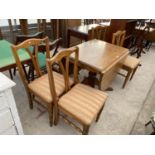 A PINE DINING TABLE AND FOUR PINE DINING CHAIRS