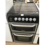 A CANNON CERAMIC HOB COOKER WITH DOUBLE OVEN AND GRILL IN NEED OF MINOR CLEAN IN WORKING ORDER
