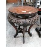 A CHINESE CARVED WOODEN JARDINIERE STAND WITH STAR OF DAVID SHELF DESIGN