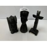 THREE CARVED EBONY FIGURINES